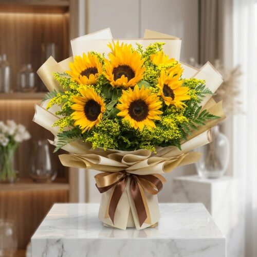 Bouquet de Girasoles LAIA con 10 flores frescas y radiantes, envuelto en papel coreano elegante y lazo marrón, sobre mármol b